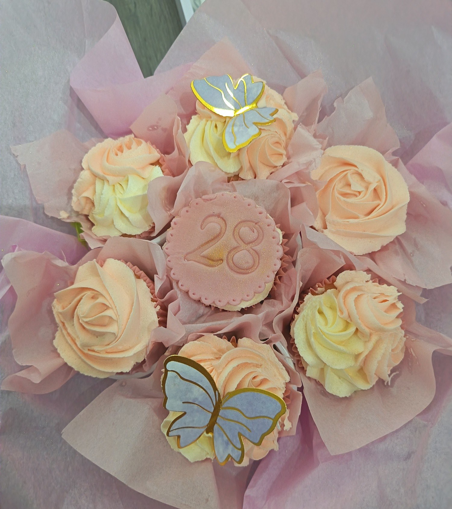 A bouquet of cupcakes with butterfly decorations by LB Bakes & Treats
